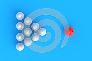 Red bowling ball and white pins in form of triangle on blue background