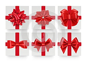 Red bows top view. Realistic gift bow with ribbon. White present boxes decorations vector set