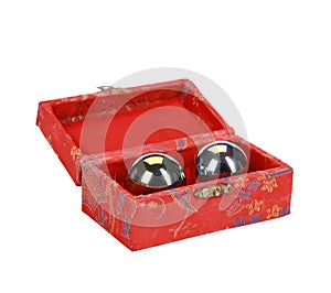 Red box with Feng Shui stress balls isolated on a white