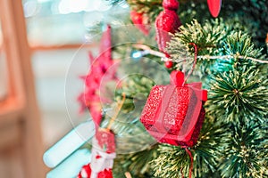 Red box gift decorated on Christmas`s tree