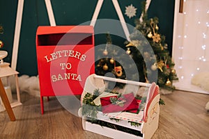 Red box for letters to Santa. Decoration for Christmas time. New Year concept