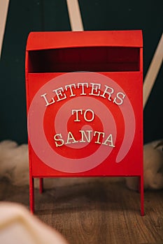 Red box for letters to Santa. Decoration for Christmas time. New Year concept
