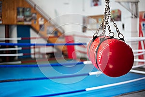 Red boxing equipment in the gym class