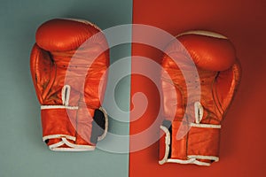 red boxing gloves on a red and blue background