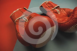 red boxing gloves on a red and blue background