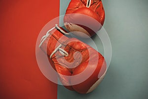 red boxing gloves on a red and blue background