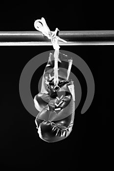 Red boxing gloves on a ring. black background