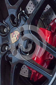 red break on wheel of Porsche sport car