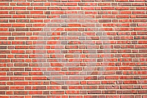 Red brick background with a thick layer of cement, a fragment of a brick wall