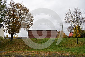 red brick building behind a dam wall