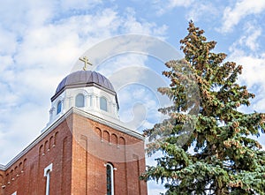 The red brick building of an old Russian Orthodox church