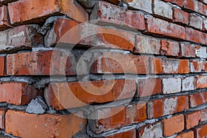 Red brick building scheduled for demolition, wrongly placed wall by the bricklayer