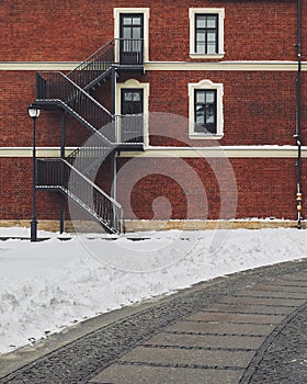 Red brick building. Staircase, the facade of the building. fire exit