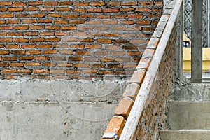 Red brick building structure is fragile. Horizontal Wide Brickwall Background.