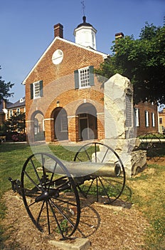 Red brick courthouse with cannon in foreground, Fairfax County, VA photo