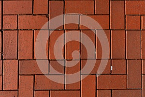 Red brick floor paving clinker brick in imperial format texture. Herringbone Brick clinker textures.