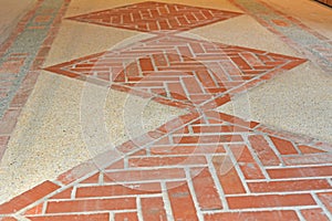 Red brick geometric diamond pattern floor photo
