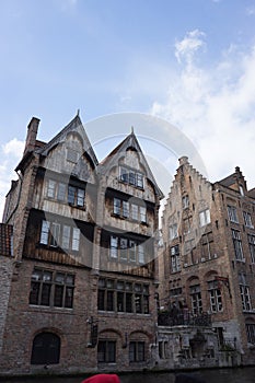 A red brick house with a gable in the city if Bruges, Belgium