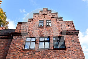 Red brick old building in Nikiszowiec historic mining district of Katowice, Poland photo