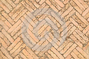 Red brick paving stones on a sidewalk