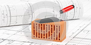 Red brick stone with trowel on top on architectural building construction plan background and drawing plan roll, construction or