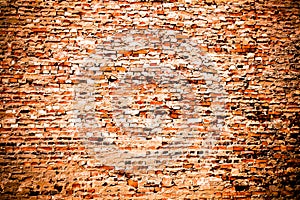 Red brick wall background:old weathered grungy red orange brick wall covered by cement and grey paint texture background