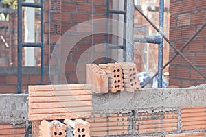 Red brick wall background under house construction,vintage filter effect