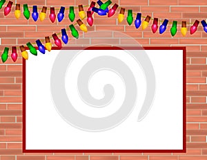 Red brick wall with Christmas lights and frame for some text.