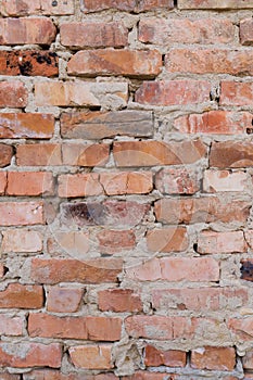 Red brick wall, close-up, brickwork background. Old building materials