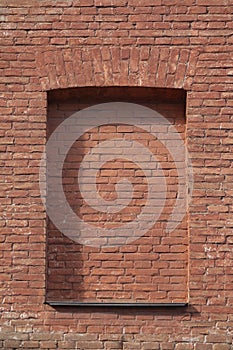 Red brick wall with closed windows
