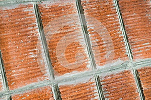 Red brick wall closeup.