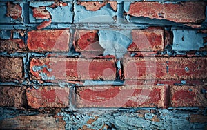 Red brick wall, disintegrated, weathered surface