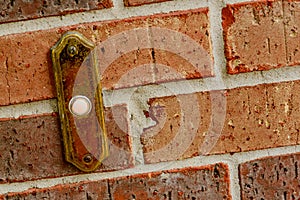 Red brick wall with doorbell
