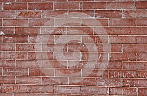 Red Brick Wall with Graffiti Scratch