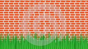 Red brick wall and green grass from below.