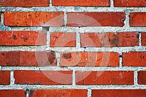 Red brick wall with hole as a background