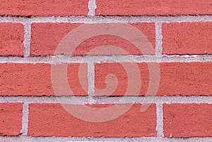 Red brick wall horizontal row rectangle stone cement stripes grunge style closeup background design base urban style