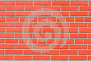Red brick wall with an ideal masonry, background