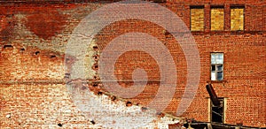 Red brick wall of old abandoned factory