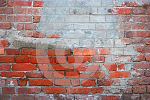 Red brick wall with part coverd with plaster