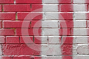 Red brick wall splashed with white paint pattern . graffiti texture