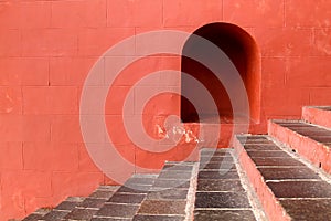 Red brick wall with stairs