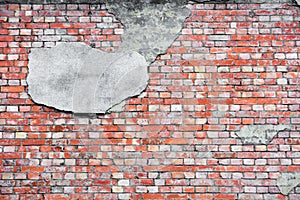 Red brick wall texture with cracked concrete stucco layer background