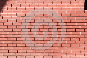 Red brick wall texture grunge background for home. Wide panoramic view of the building with good detail. Abstract wallpaper surfac