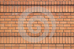 Red brick wall texture grunge background for interior and home design. Wide panoramic photo of the building with good detail. Abst