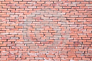 Red brick wall texture grunge background with vignetted corners, photo