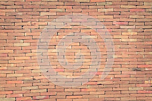 Red brick wall texture grunge background with vignetted corners, may use to interior design. photo