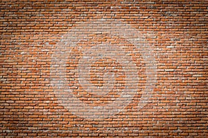 Red brick wall texture with vignetted corners photo