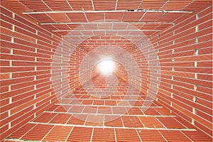 Red Brick wall tunnel with light
