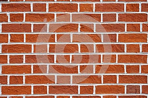 Red brick wall with white joints